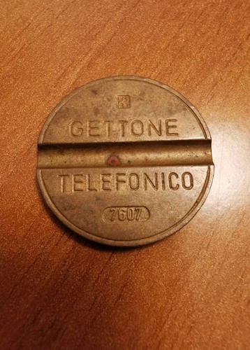 Gettone telefonico con segno - con,